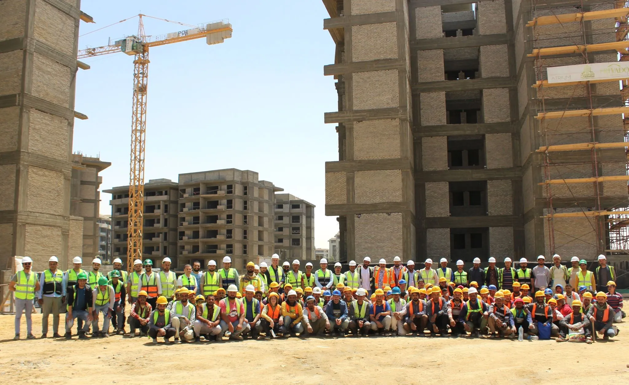 Graduate Program Orientation group photo on a construction site
